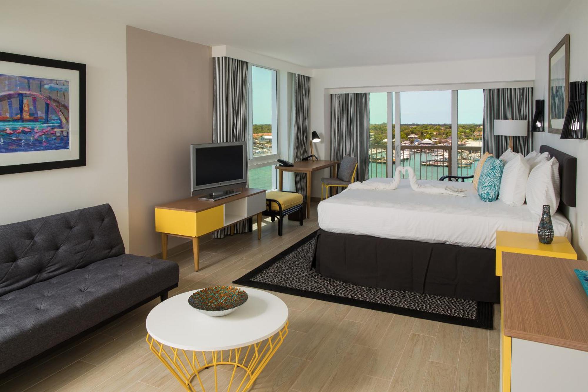 Hébergement Lit King-Size Premium avec Balcon - Côté Port